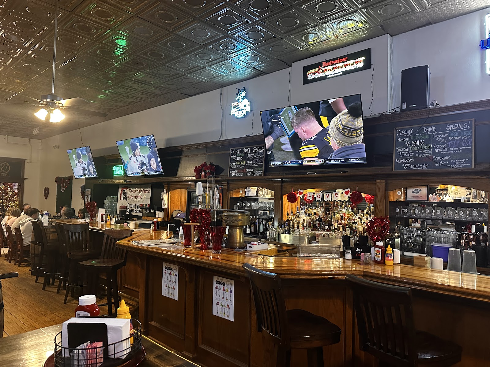 The full bar at 627 Event Space with TVs and drink selection