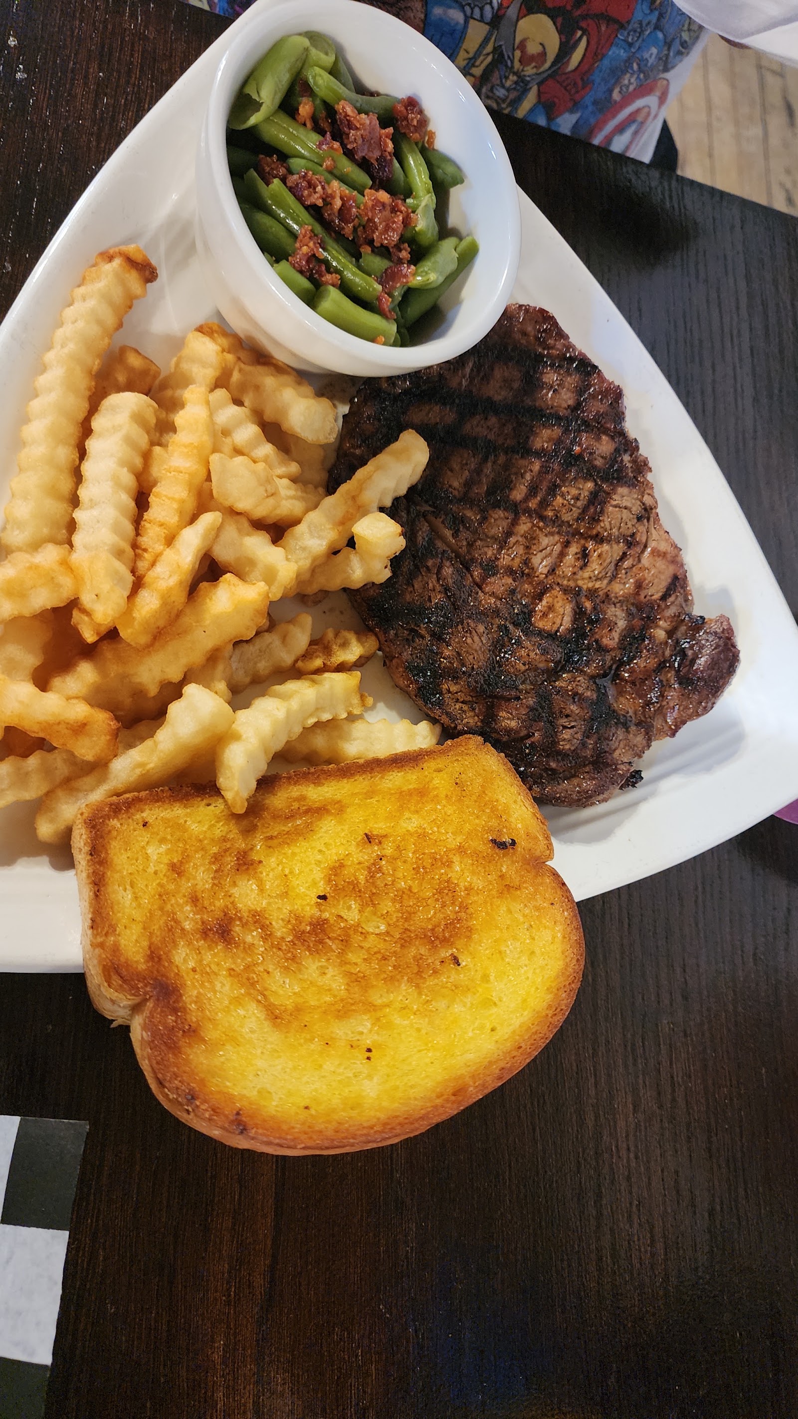 Grilled steak with crinkle fries and Texas toast